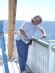 Painting the railing.