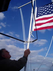 Raising the US flag.