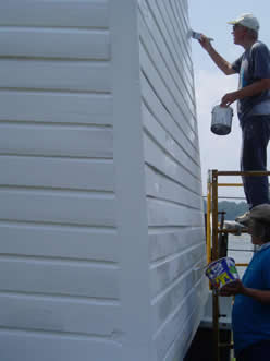 Lawrence and Lauren give a second coat of paint.