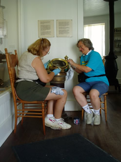 Sandra and Lauren polishing brass.